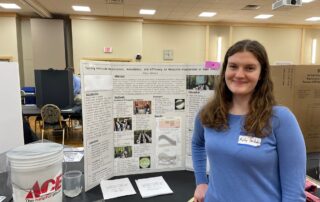 Molly presents her poster at the Regional Science Fair