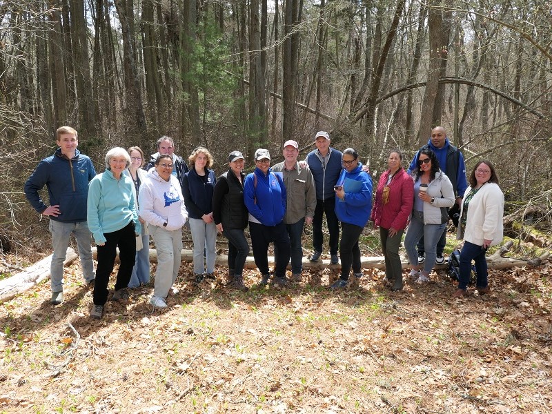 Tour participants gather for a photo by DCLT's Fresh Pond North property.